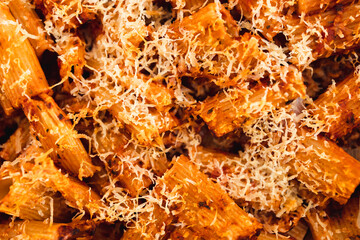 plant-based food, vegan rigatoni pasta bake with red pesto sauce and dairy free cheese