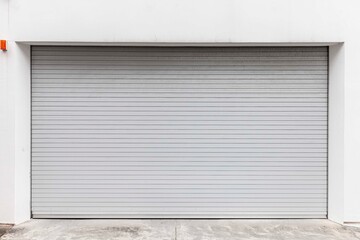 Automatic white roller shutter doors on the ground floor of the house