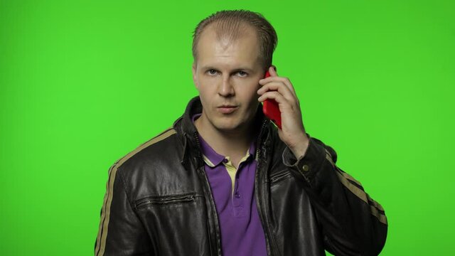 Man asks to call him for making money, talking on mobile phone with proud, online distance work