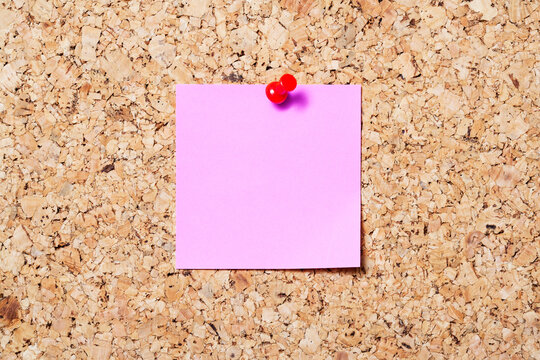 Sticky note on cork board
