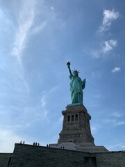 Fototapeta na wymiar The Statue of Liberty under clear blue sky 