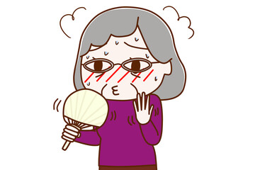 暑くて火照ったのでうちわであおぐ高齢の女性
