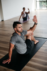 Fototapeta na wymiar Man stretching and practicing yoga