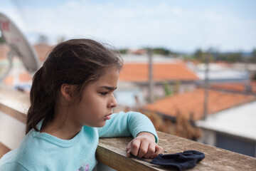 child bored at home because of the pandemic