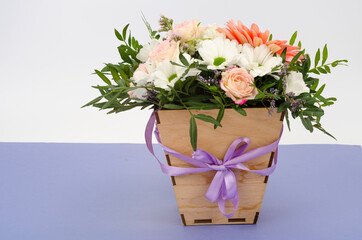 Flowers, bouquet in stylish wooden box. Studio Photo