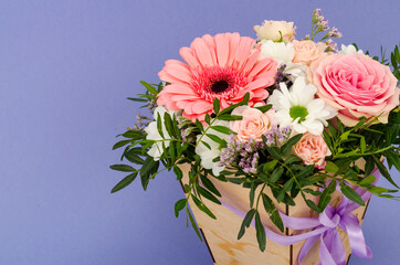 Flowers, bouquet in stylish wooden box. Studio Photo