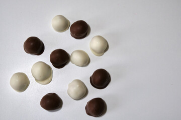 fresh red and shiny fresh raspberries dipped in homemade black and white chocolate