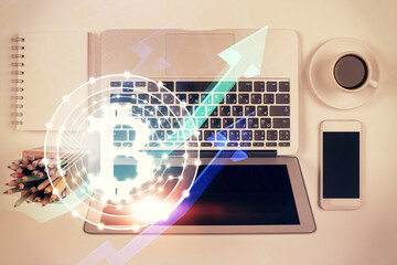 Blockchain theme hologram drawings over computer on the desktop background. Top view. Double...