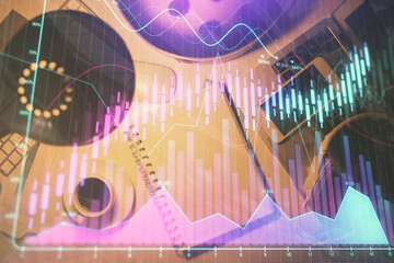 Fototapeta premium Multi exposure of forex chart drawing and work table top veiw. Concept of financial analysis.