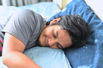 Fototapeta na wymiar Portrait of a man getting a good nights sleep.