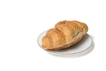 Fresh croissant on a white plate isolated on a white background.