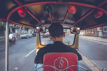 Tuk Tuk driver in Bangkok, Thailand.