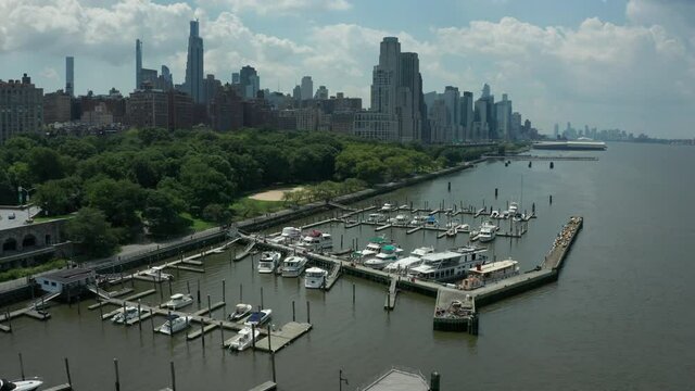 flying south & tilting down on 79th St. Boat Basin on west side of Manhattan