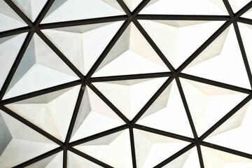 A triangle grid pattern of a white black metal rooftop for background backdrop