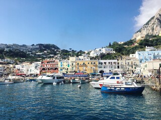 Fototapeta na wymiar boats and yachts in bay, Capri, Italy, Amalfi Coast, Mediterranean, coastal town, island, cliffs