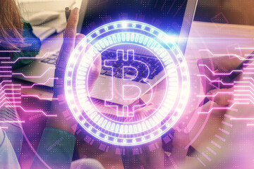 Double exposure of man and woman working together and crypto finance theme hologram. Blockchain business concept. Computer background.