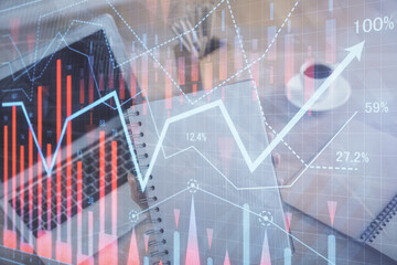 Double exposure of businesswoman hands typing on computer and forex chart hologram drawing. Financial analysis concept.