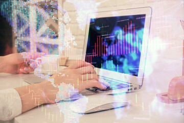 Double exposure of woman hands typing on computer and forex chart hologram drawing. Stock market analysis concept.