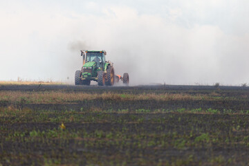 truck putting fire down on crop field