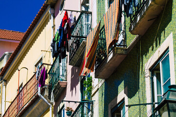 View of classic facade of ancient historical buildings in the downtown area of Lisbon, the hilly coastal capital city of Portugal and one of the oldest cities in Europe