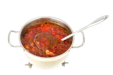 Saucepan with vegetable beetroot soup on white background.
