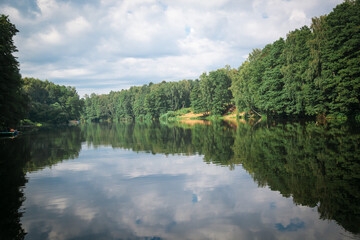 River in the Park with beautiful trees and clouds.