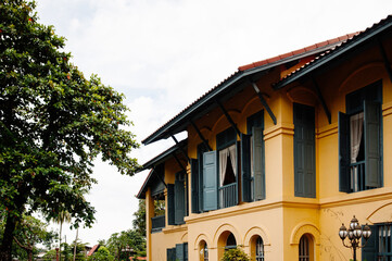 Nakhon Phanom old Governor house with colonial architecture style and big tree - Thailand