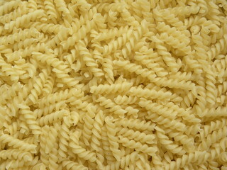 Yellow color raw dry Spiral pasta