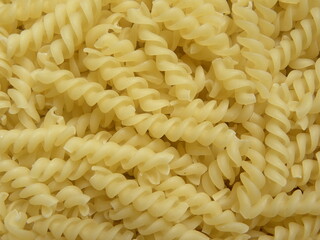 Yellow color raw dry Spiral pasta