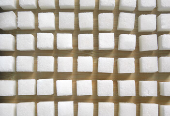 White color granulated Sugar cubes stacked up