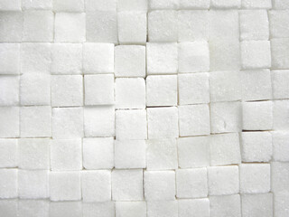 White color granulated Sugar cubes stacked up