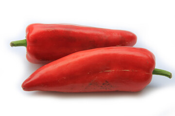 Red, orange and yellow  fresh long  peppers isolated on white background. Summer vegetables 
