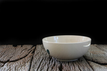 White ceramic bowl empty on wooden table. Asian style of food.