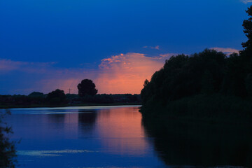 Fototapeta na wymiar Sunset in the delta of the Volga River on the river Baklanya. The Astrakhan region. Russia.Blurred background.