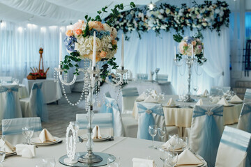 Close up of centerpiece at wedding reception. Luxury elegant table setting dinner in a restaurant