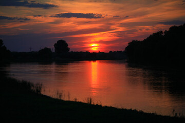 Sunset in the delta of the Volga River on the river Baklanya. The Astrakhan region. Russia.Blurred background.