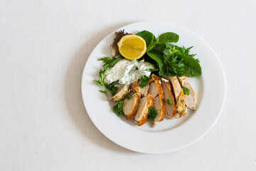 Greek Style Chicken with Salad and Tzatziki Sauce