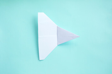 assembly procedure of a paper white airplane. Origami. C