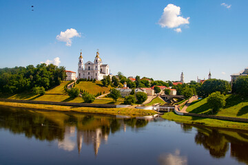 Fototapeta na wymiar Vitebsk,Belarus - 18 July 2020 : Holy Assumption Cathedral of the Assumption on the hill and the Holy Spirit convent and Western Dvina River. Vitebsk, Belarus