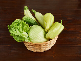 Group of fresh green vegetables in a basket