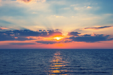 emerald summer sea coast at the sunset