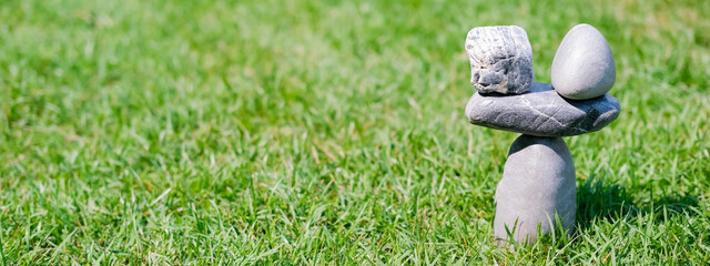 Symbol scales is made of stones of various shapes. Balance of stones. To weight pros and cons. Banner.