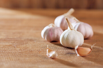 Garlic cloves on wooden table.