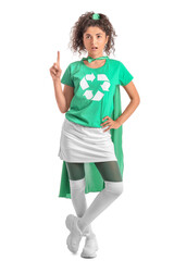 Woman dressed as eco superhero with raised index finger on white background