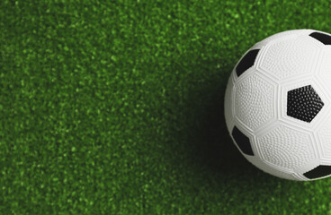 Fototapeta na wymiar Soccer ball on green field