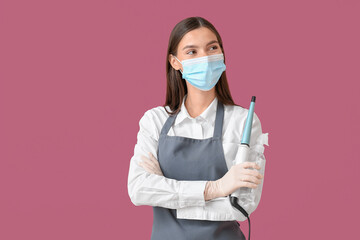 Fototapeta na wymiar Female hairdresser wearing medical mask on color background. Coronavirus epidemic