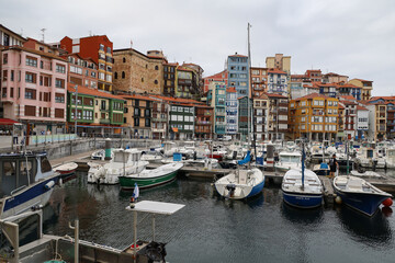 Fototapeta na wymiar The magnificent port of Bermeo under a cloudy sky in the Basque Country