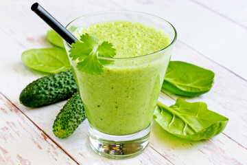 Green vitamin smoothie with spinach, fresh cucumber and cilantro