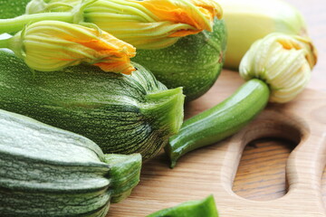 Fresh organic zucchini on the wooden table