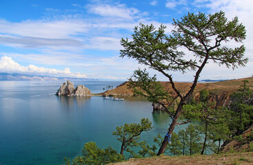 View on Cape Burhan and Shamanka rock on Olkhon island of lake Baikal on the background of pine, Russia